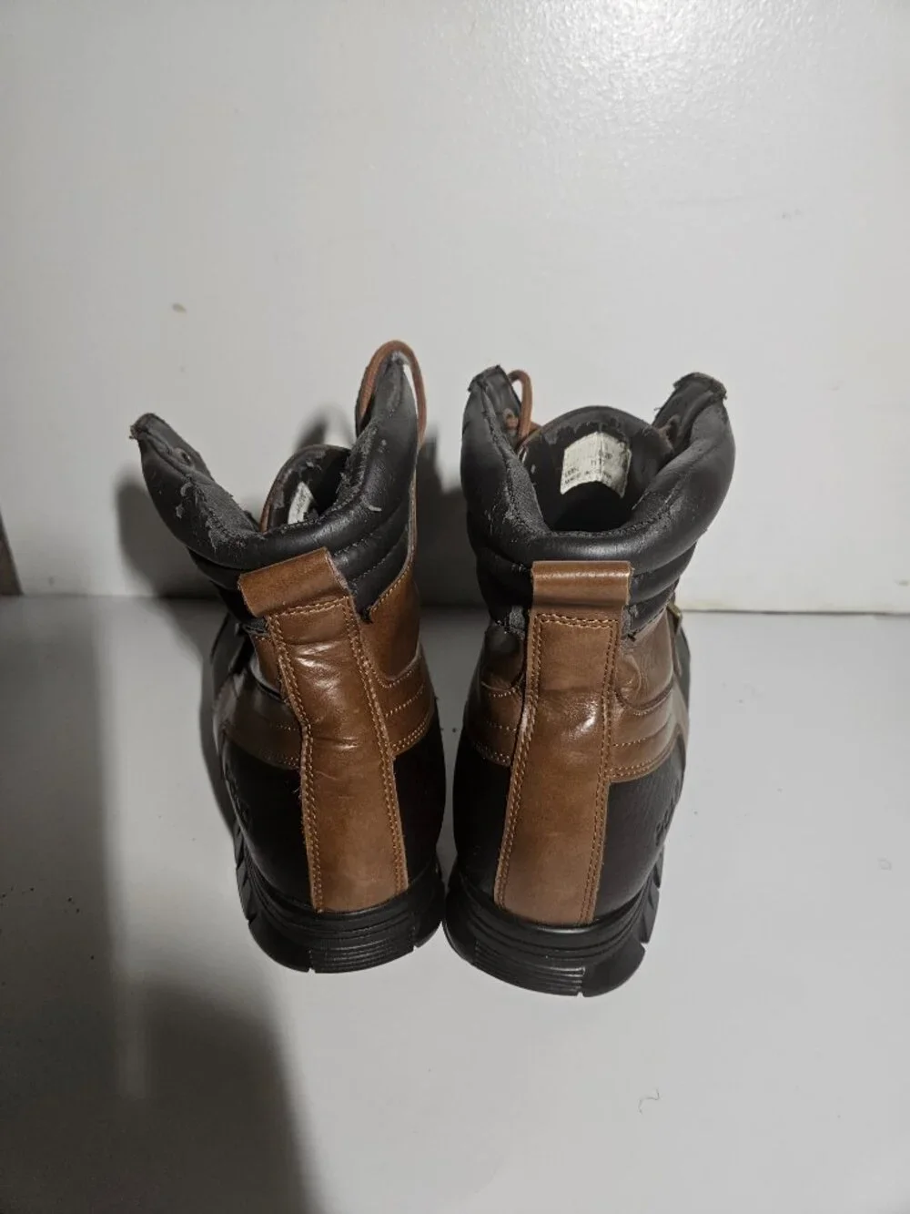 Men’s size 11.5 Polo Ralph Lauren duck boots in brown/black leather.
